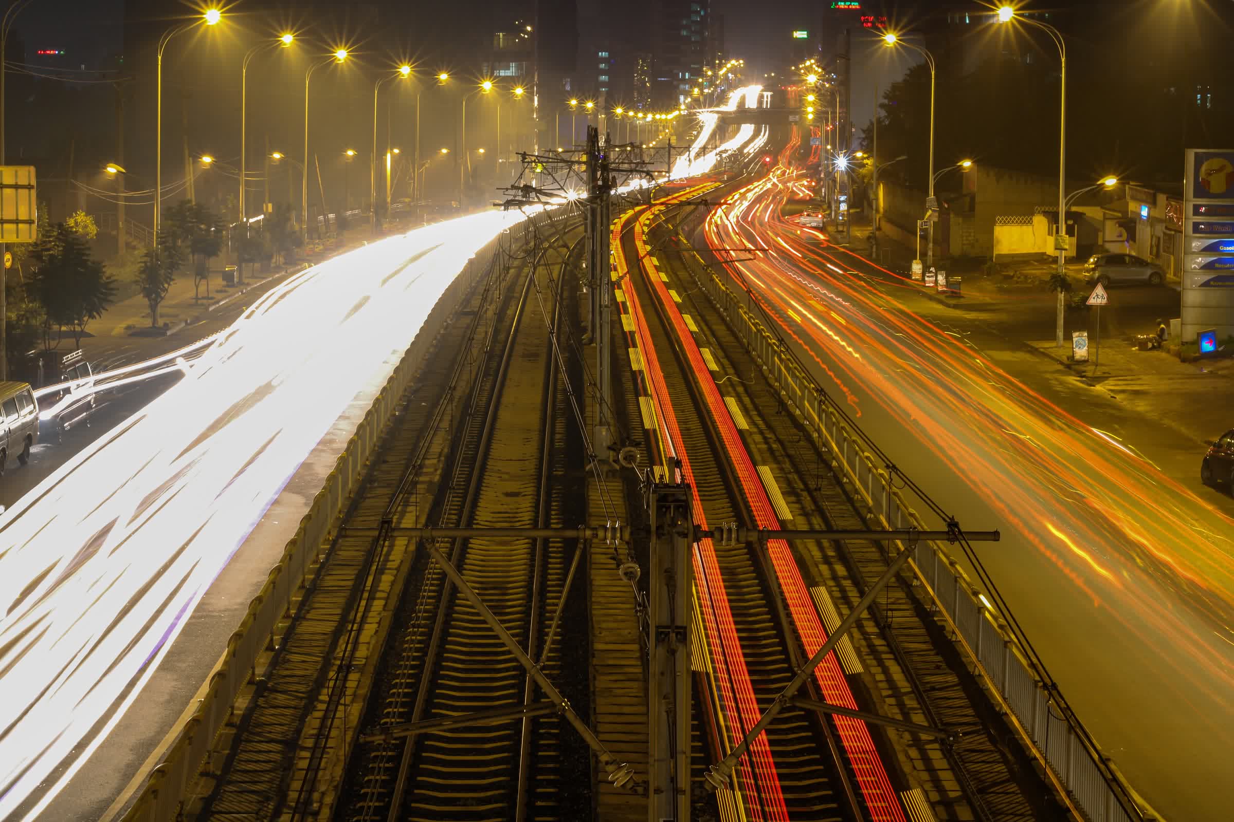 Long-exposure light trails along the Addis Ababa light-rail line at Megenagna by night